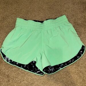 Lululemon reversible hotty hot shorts, green and patterned.